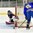 GRAND FORKS, NORTH DAKOTA - APRIL 21:  Sweden's Rickard Hugg #15 plays the puck while Slovakia's Roman Durny #30 defends during quarterfinal round action at the 2016 IIHF Ice Hockey U18 World Championship. (Photo by Matt Zambonin/HHOF-IIHF Images)

